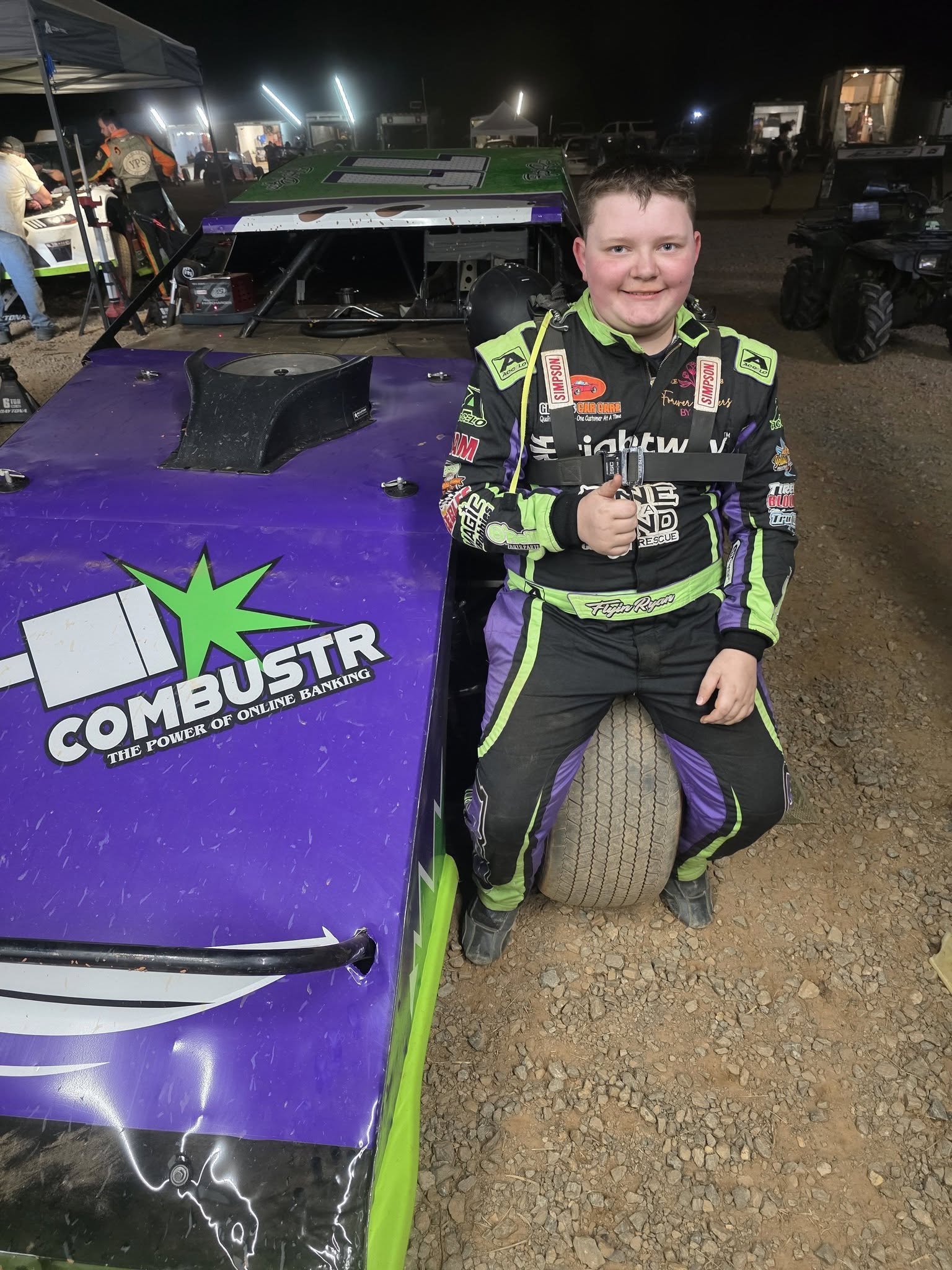 Ryan Johnston beside his #11J Econo Modified